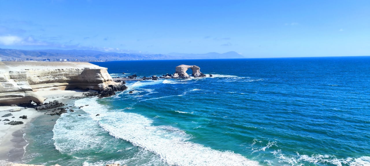 Rock arch, cliffs and ocean along the Chilean coast
