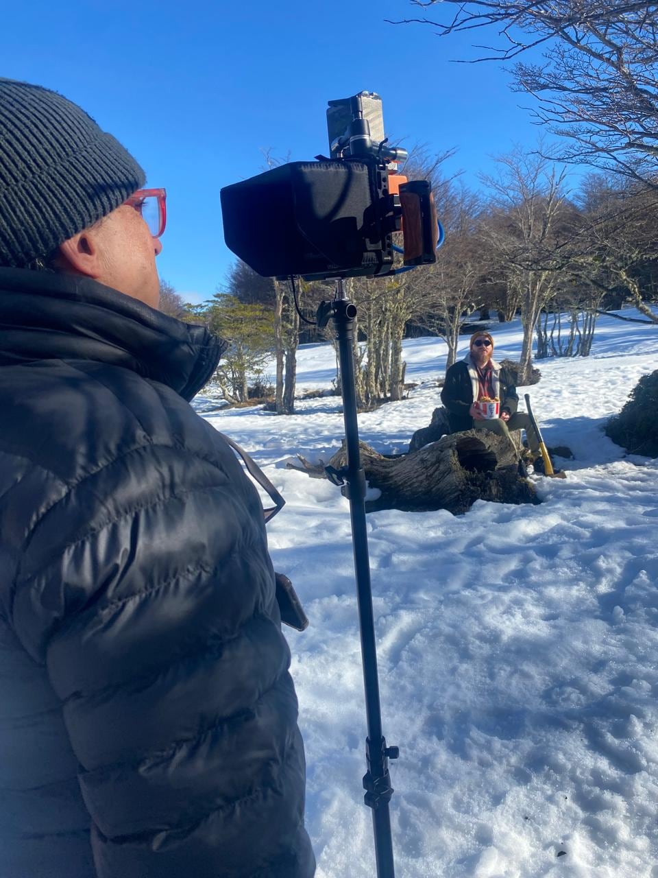 Media Orange crew working around a camera during a production in snowy Chile